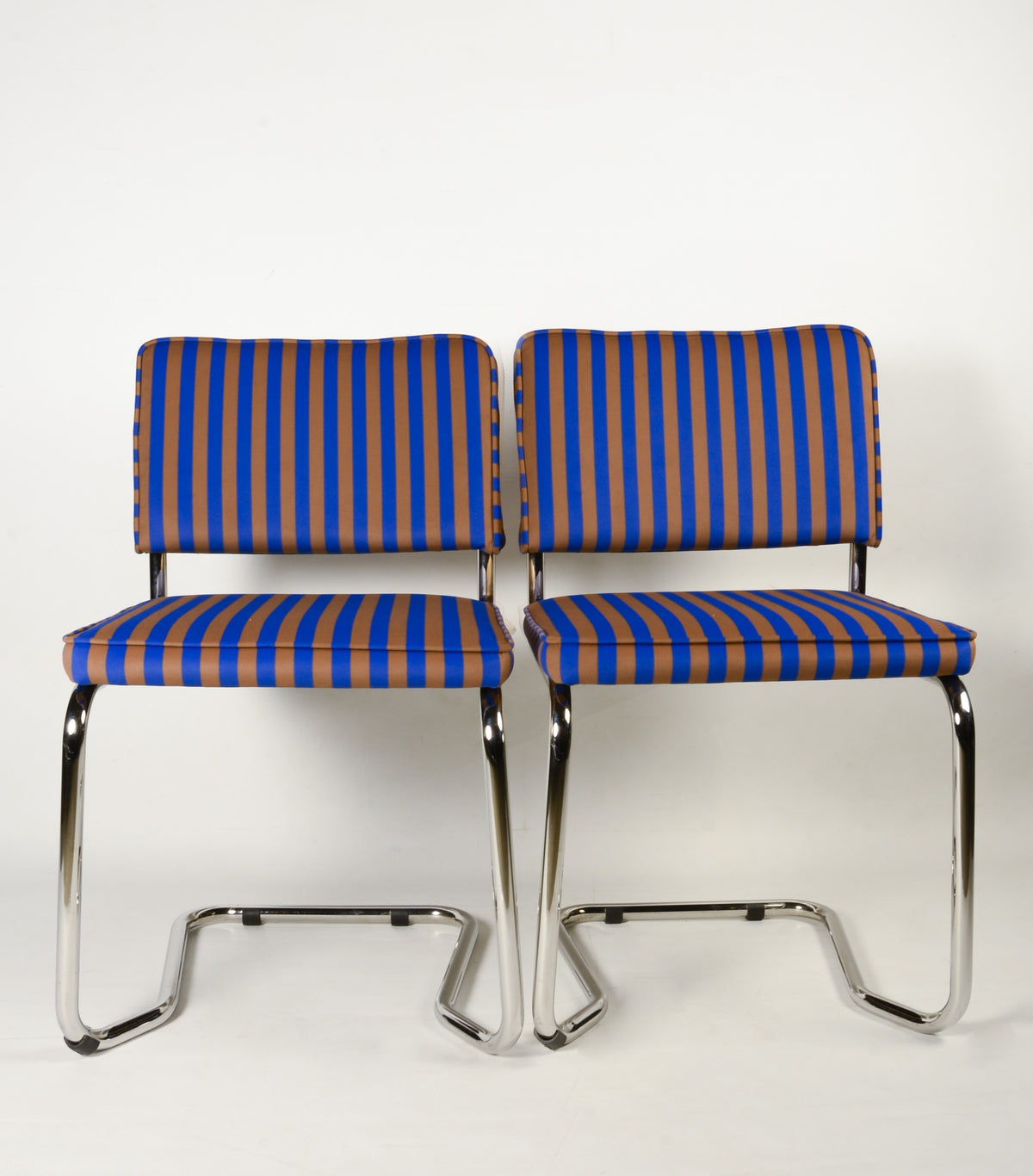 Upholstered chair in blue and brown striped velvet