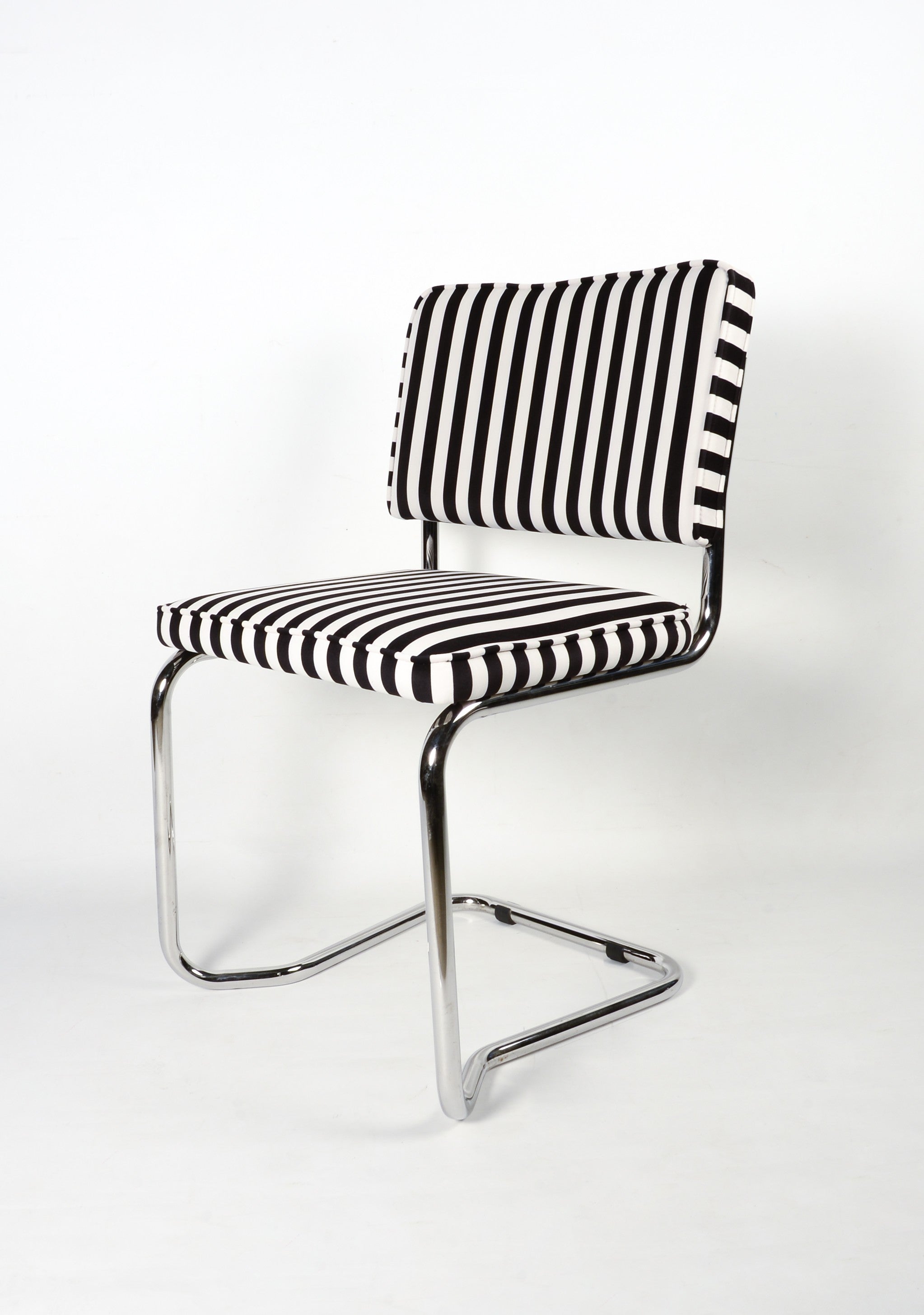 Upholstered chair in black and White striped velvet