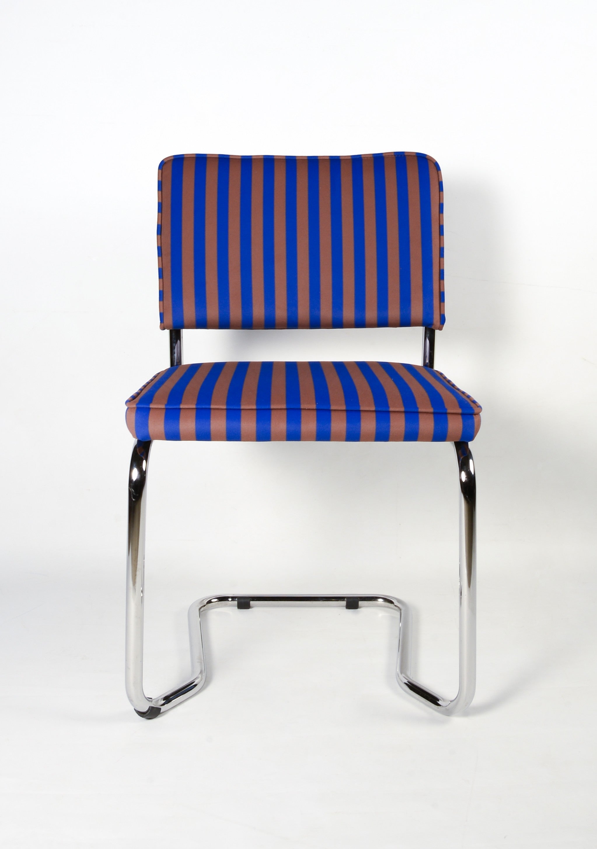 Upholstered chair in blue and brown striped velvet