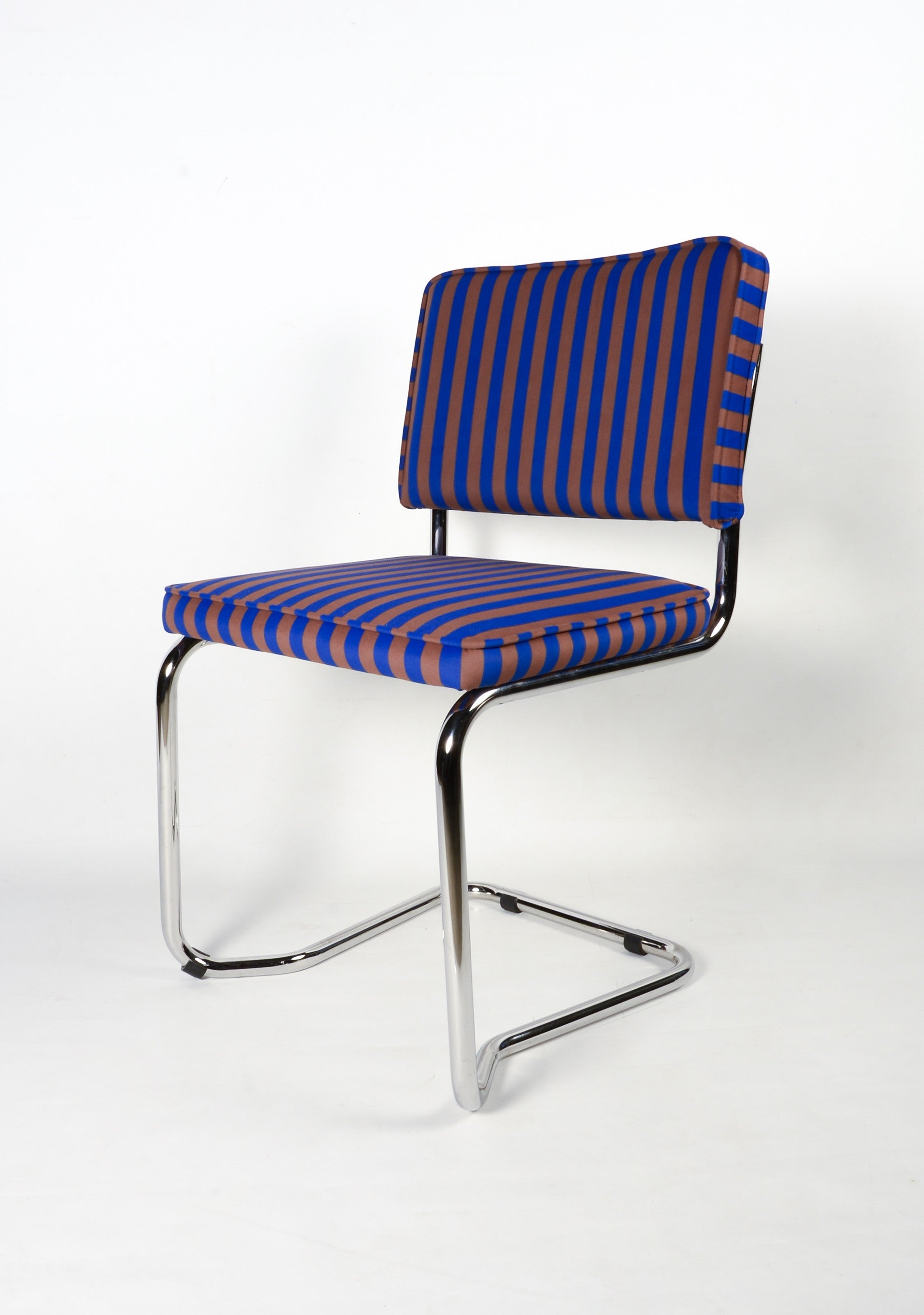 Upholstered chair in blue and brown striped velvet