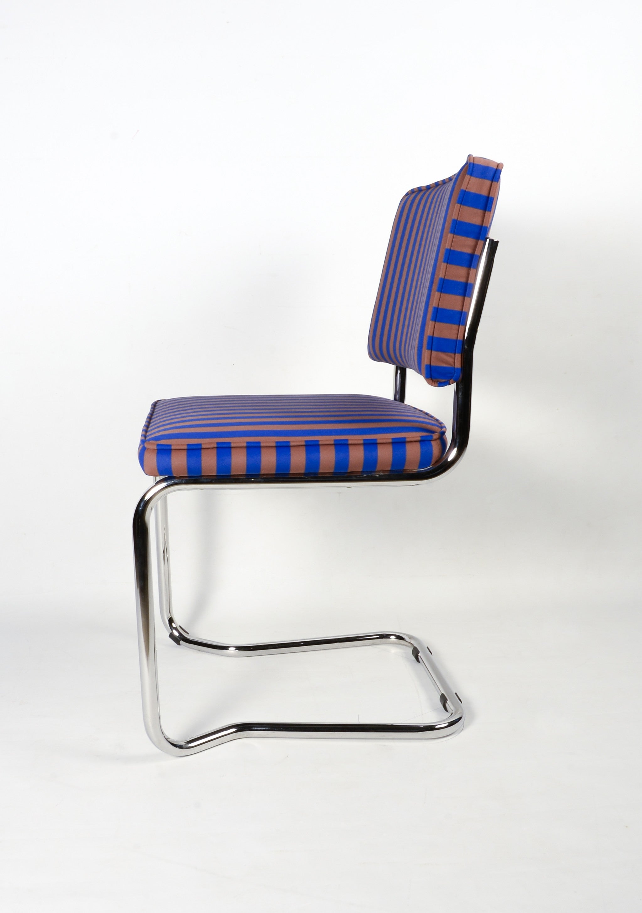 Upholstered chair in blue and brown striped velvet
