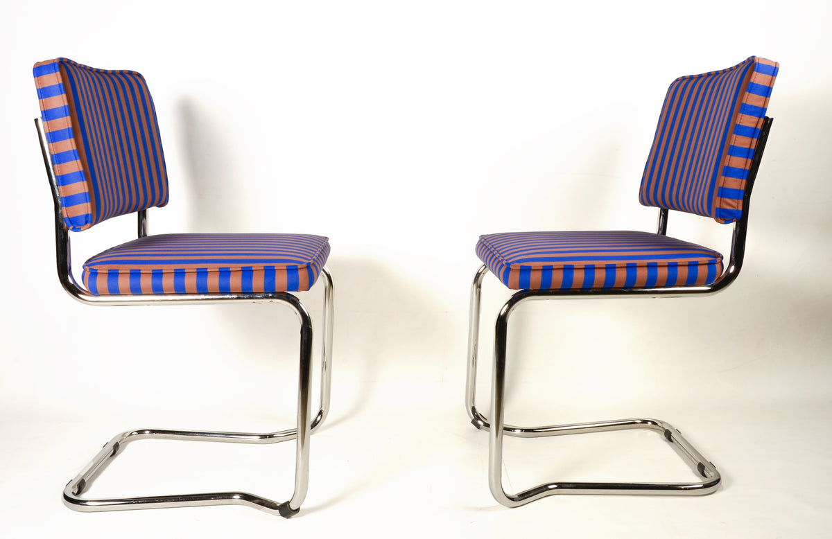 Upholstered chair in blue and brown striped velvet