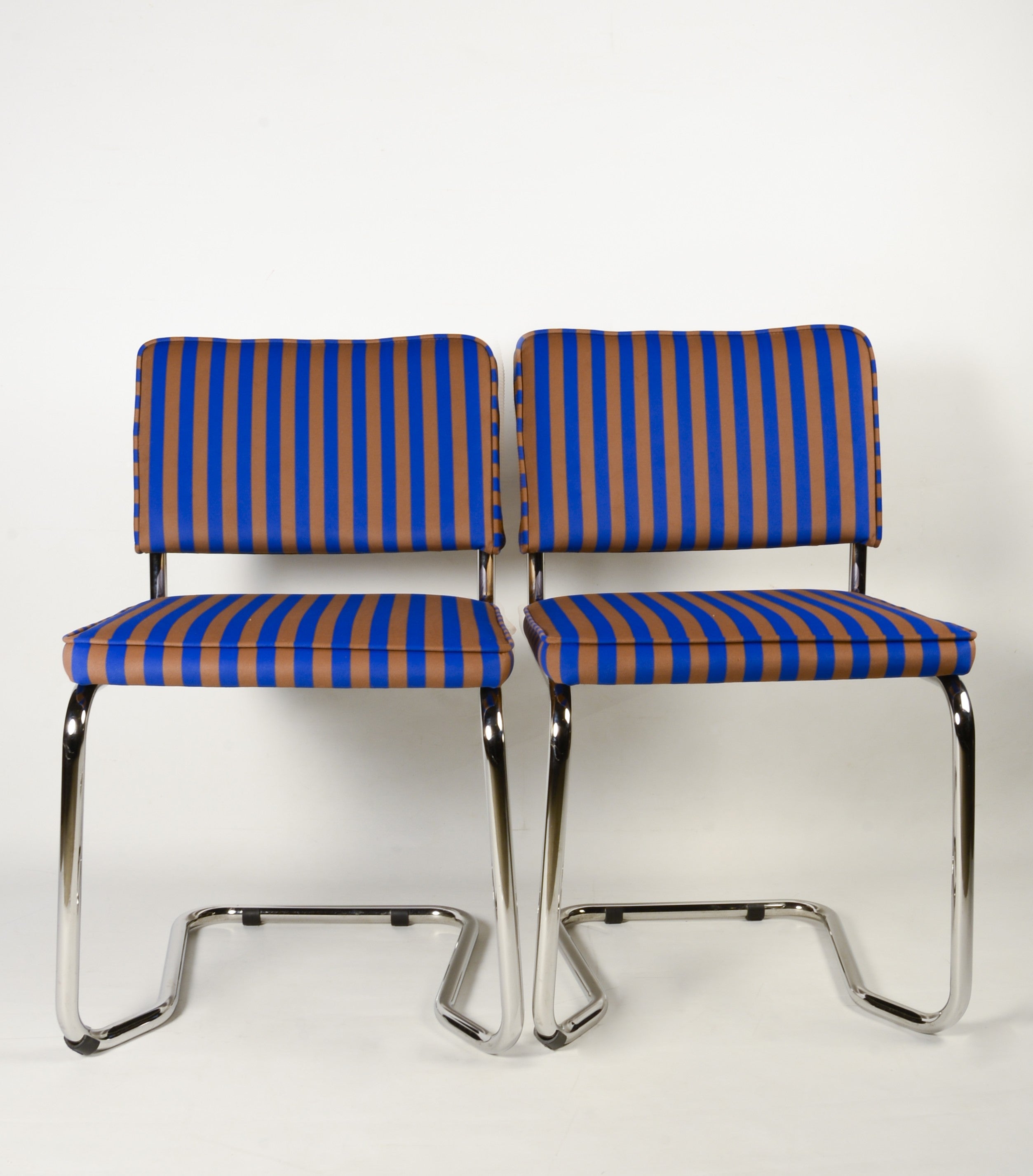 Upholstered chair in blue and brown striped velvet