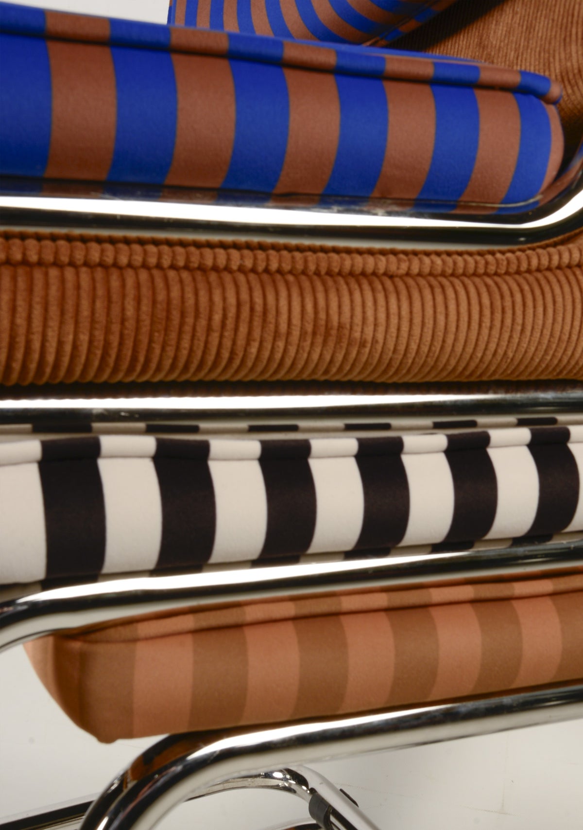 Upholstered chair in blue and brown striped velvet