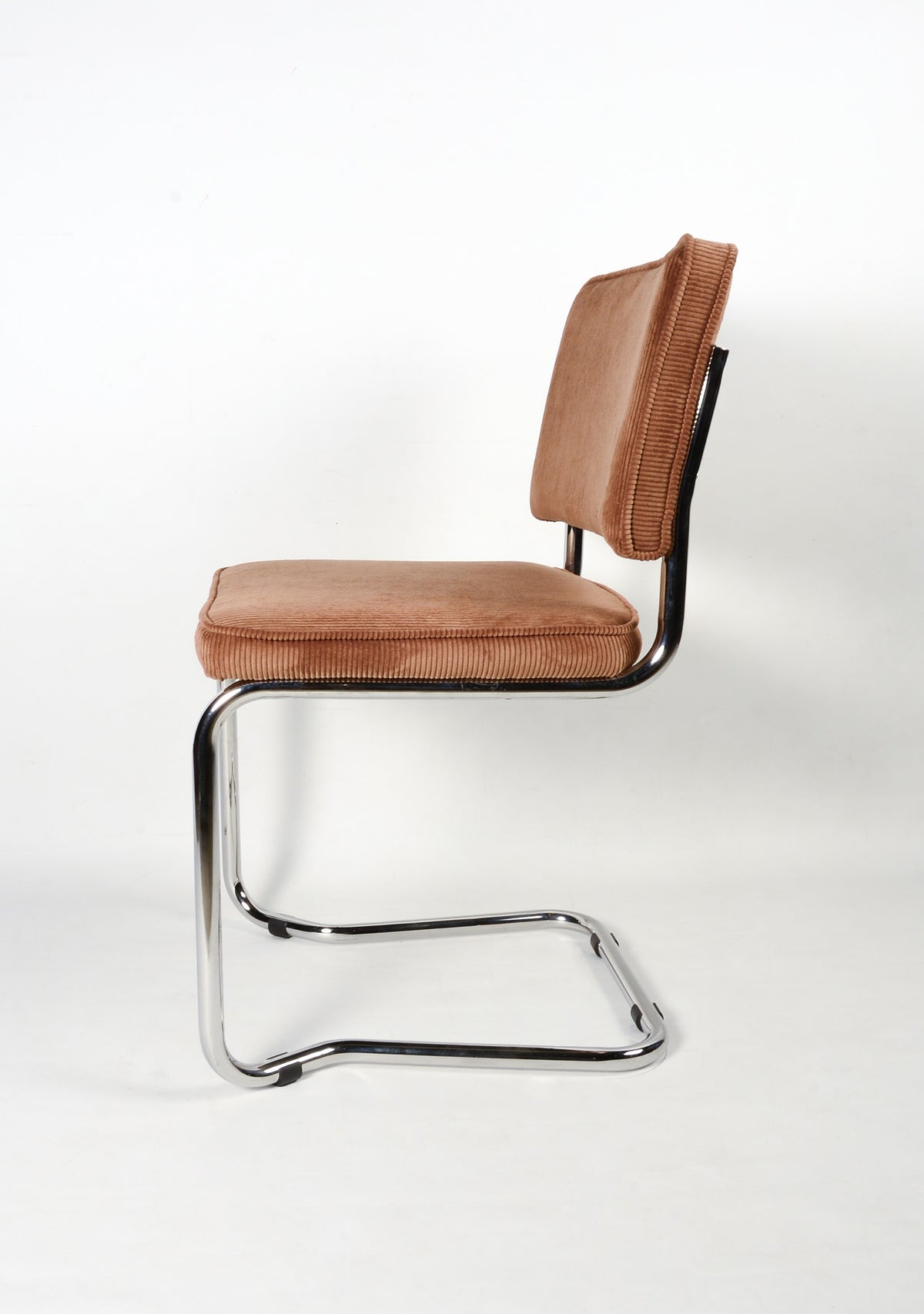 Upholstered chair with metal frame